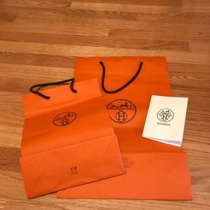 TWO Hermes shopping bags 11”x 16 1/2” and 8” x 11”